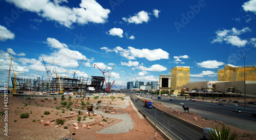 Fotografie Las Vegas skyline with football stadium in construction