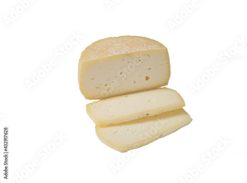 Cheese wheel and pieces of cheese on a white background