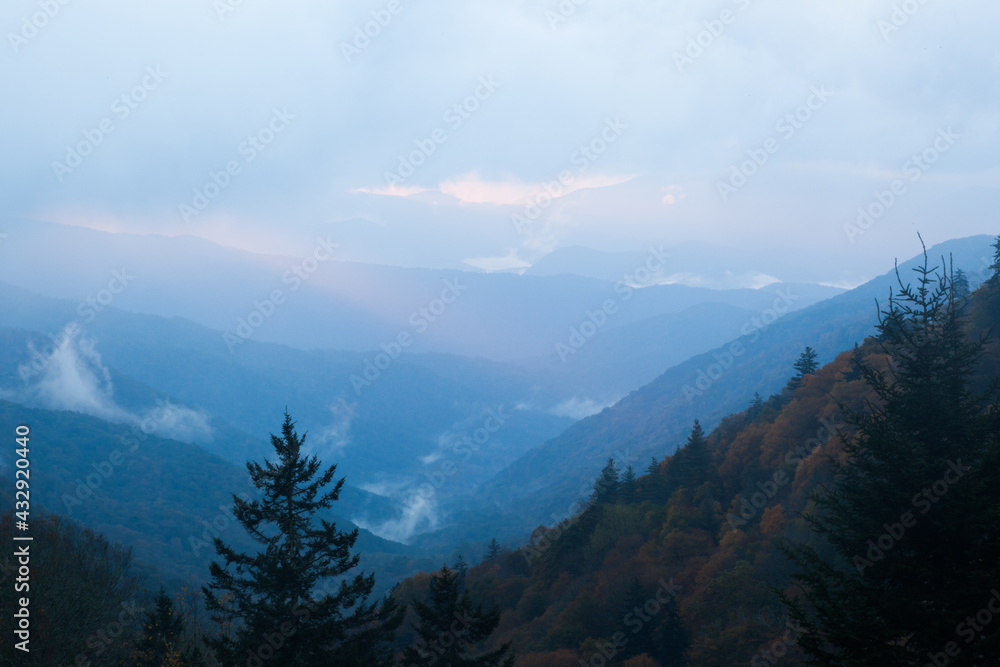 Sunrise in a mountain mist