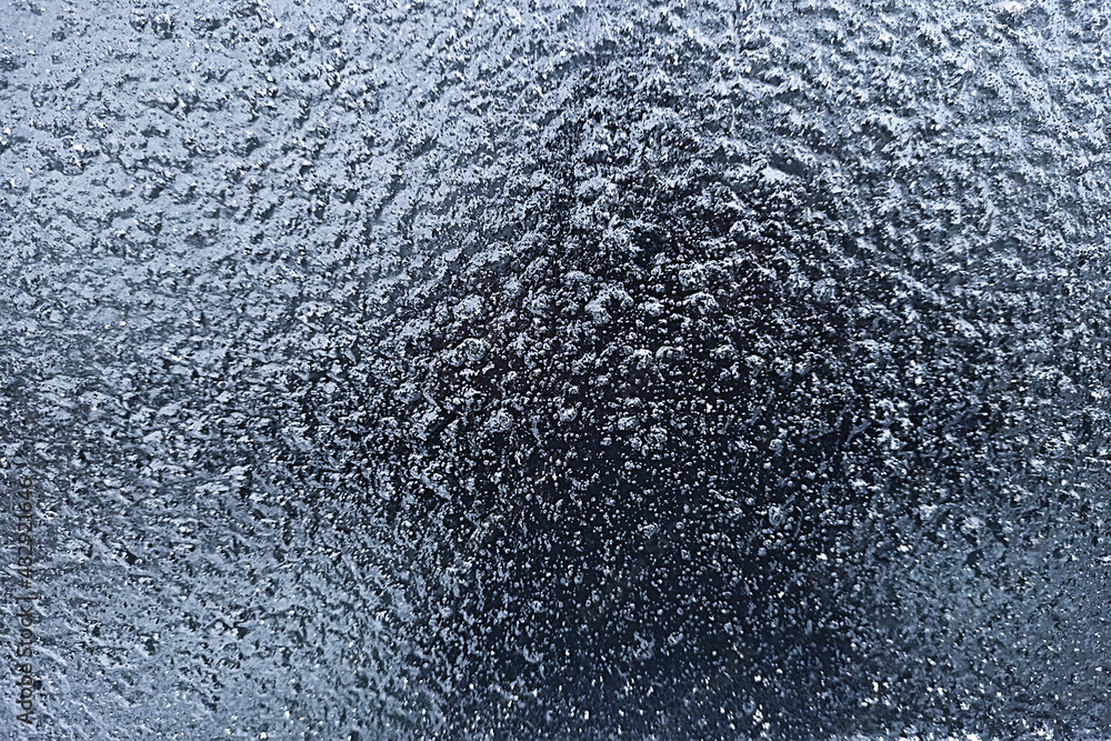Frozen drops of water on glass. Freezing rain. Abstract background, ice on glass. Frozen drops of water on glass. Freezing rain. Abstract background, ice on glass.