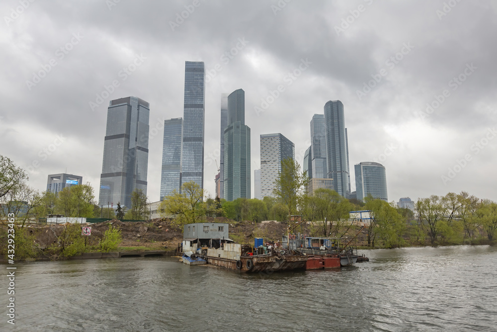 Fototapeta premium Glass skyscraper of the Moscow City business center in cloudy weather. Russia