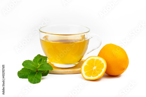 Cup of aromatic tea, mint leaves and lemon slice isolated on white background. Part of set.