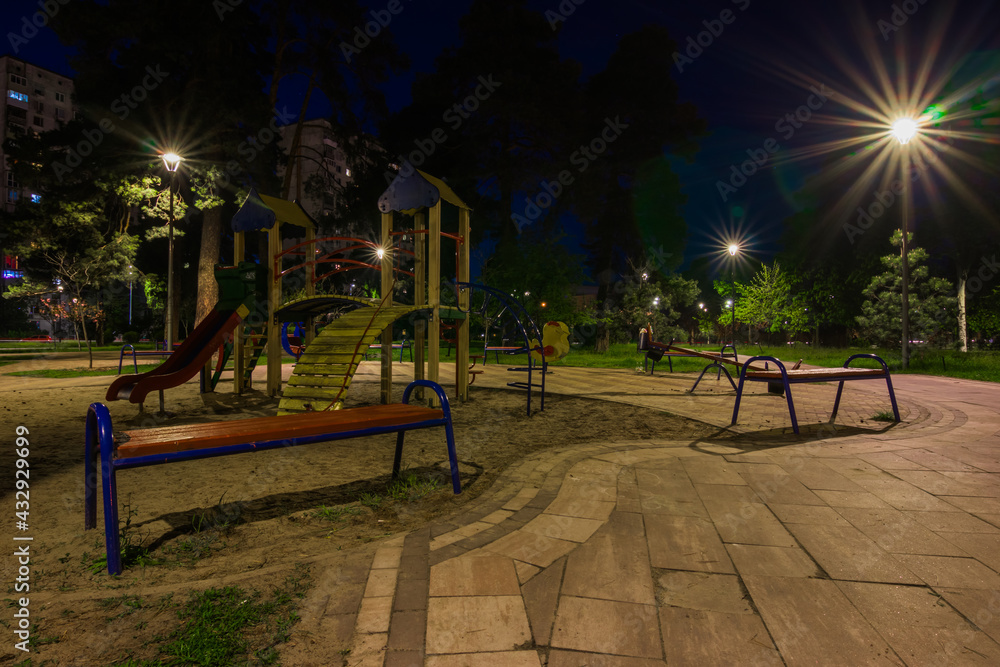Children playground at night in the green city park Children playground at night in the green city park