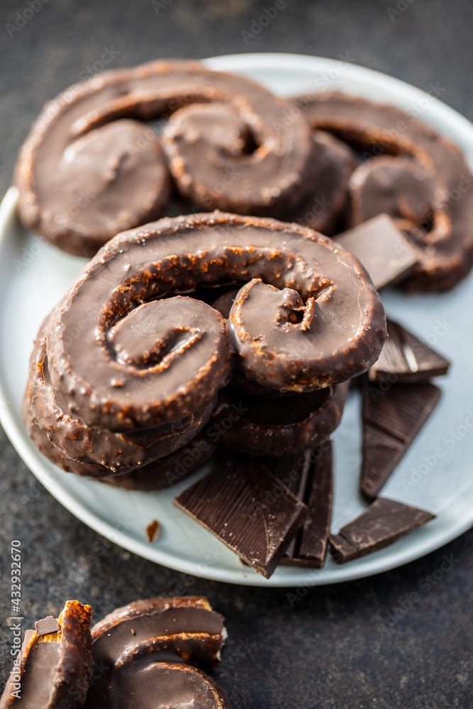 Sweet pastry palmeritas with chocolate icing.