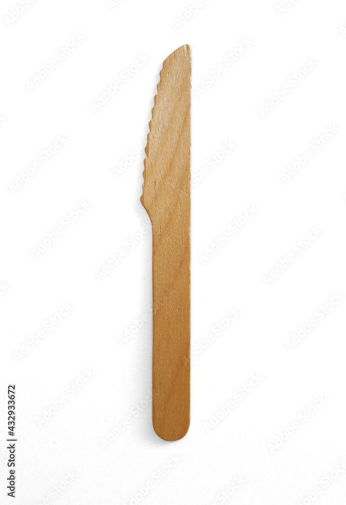 Close up of Rustic Eco-Friendly Disposable Wooden Knife. Biodegradable wooden knife isolated. Wooden utensil for parties and picnics. Eco Cutlery, household items and Home accessories. Close up of Rustic Eco-Friendly Disposable Wooden Knife. Biodegradable wooden knife isolated. Wooden utensil for parties and picnics. Eco Cutlery, household items and Home accessories.