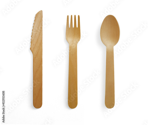 Disposable wooden cutlery set on white background. Biodegradable utensils, fork, spoon and knife. Parties, events, barbecues, weddings, picnics. Eco Cutlery, household items and Home accessories.