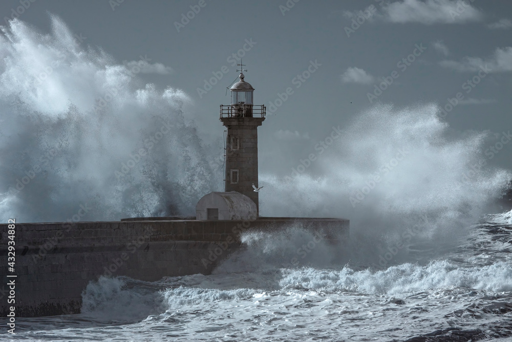 Storm at the Douro mouth north beacon and pier