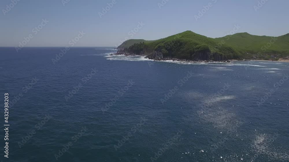 View from a droneon a stone cape washed by strong waves View from a droneon a stone cape washed by strong waves
