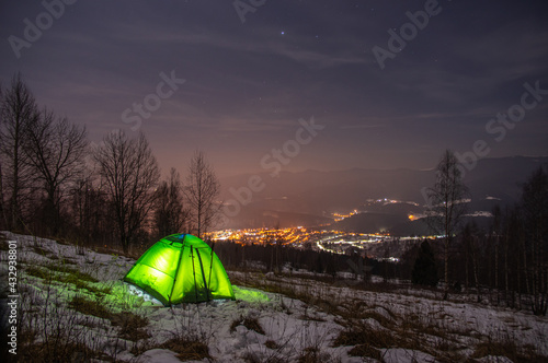 Fototapeta Naklejka Na Ścianę i Meble -  Yellow tent in winter forest at night