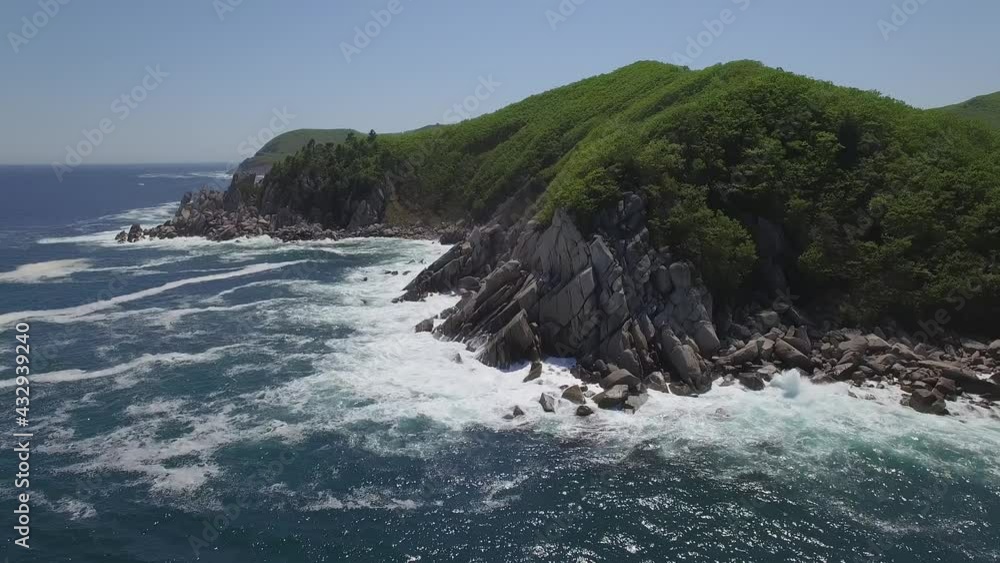 View from a droneon a stone cape washed by strong waves View from a droneon a stone cape washed by strong waves