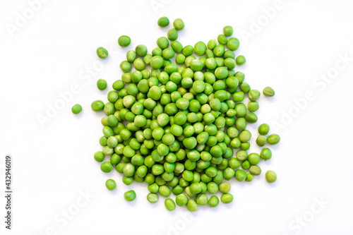 pile green peas on white background.