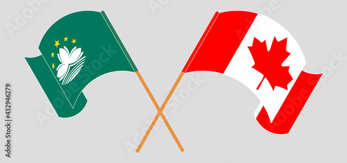 Crossed and waving flags of Macau and Canada