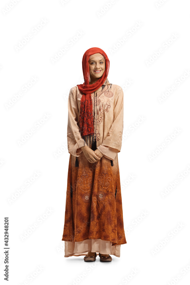 Full length portrait of a young muslim woman in traditional clothes - obrazy, fototapety, plakaty 