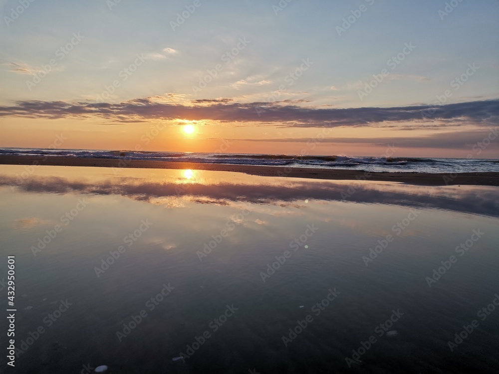 The reflection of the sun on the beach