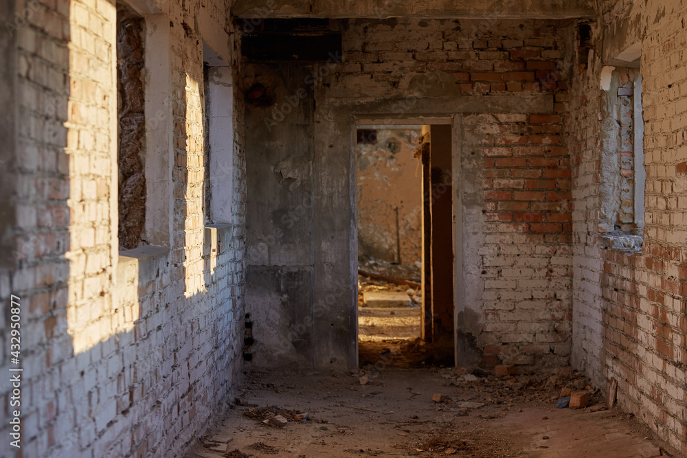 corridor of an old brick abandoned building corridor of an old brick abandoned building