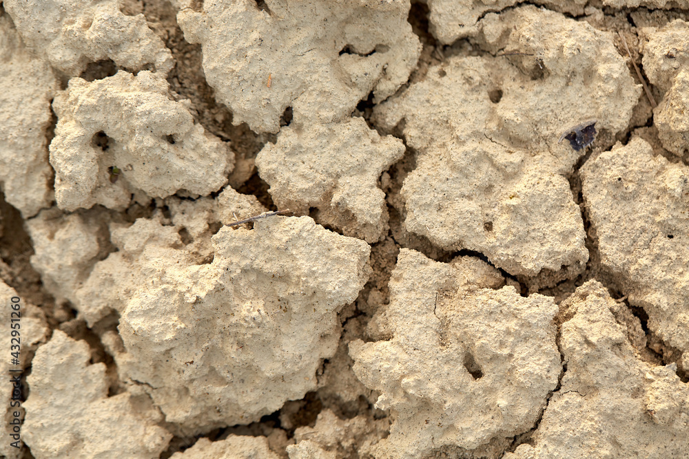 Clay cracked earth texture. Cracked clay natural background indoor macro shot.