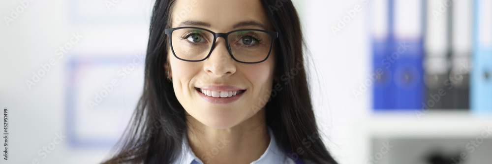 Portrait of smiling doctor with glasses in medical office Portrait of smiling doctor with glasses in medical office