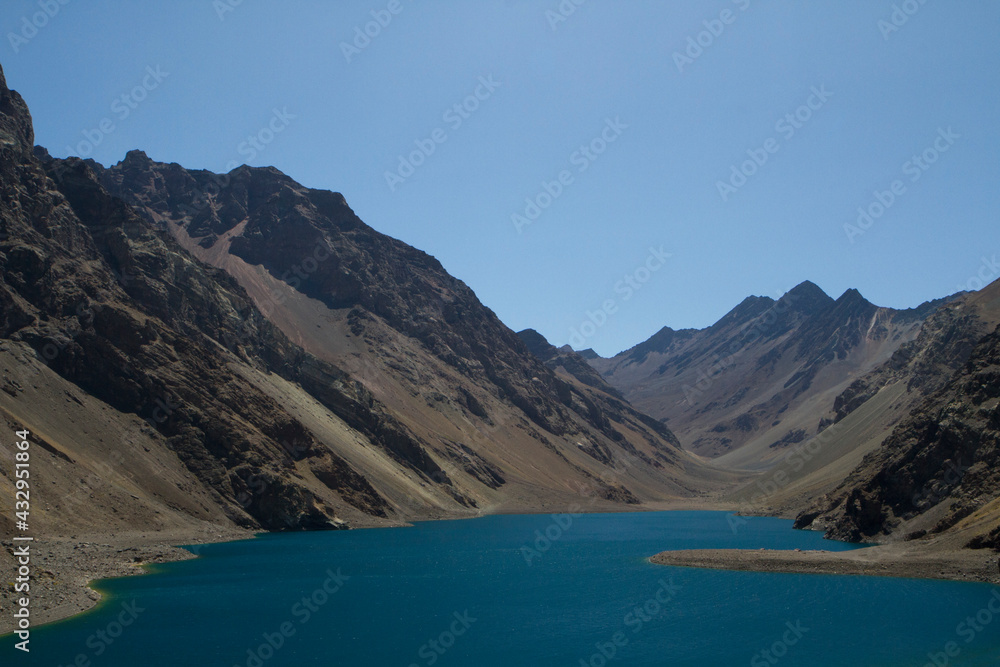 Alpine landscape. The deep blue color water glacier lake very high in the mountains.