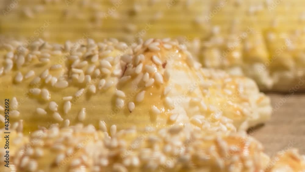 Time Lapse of baking process of puff pastry in oven, home made. Time-lapse video of puff pastry cakes with sesame baked in oven. Time Lapse of baking process of puff pastry in oven, home made. Time-lapse video of puff pastry cakes with sesame baked in oven.