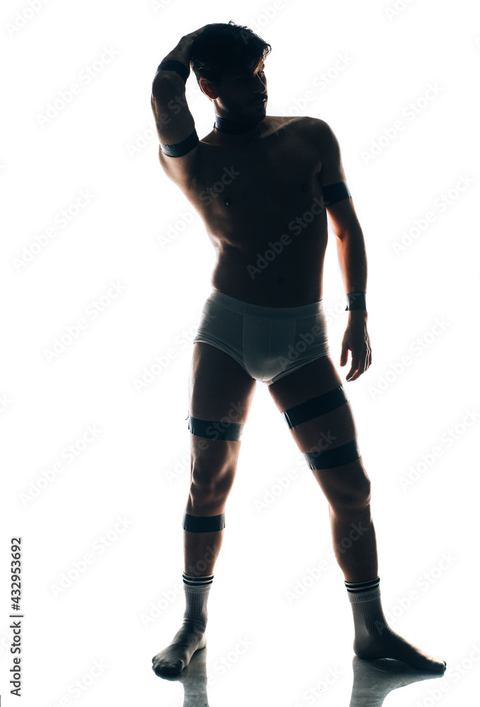 Cheerful young man in trunks over white background Cheerful young man in trunks over white background
