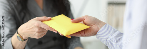Bilde på lerret Woman hands over full envelope to her interlocutor