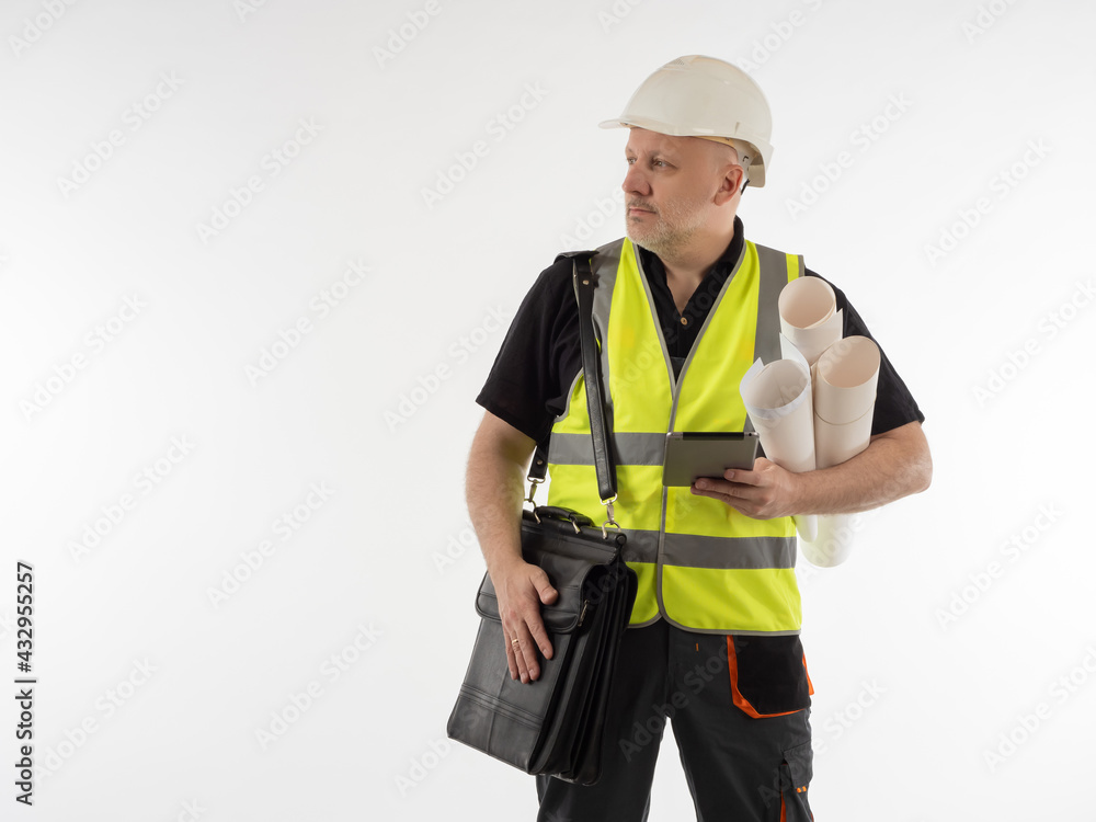 An architect in a white helmet. A construction engineer with rolls of drawings and a briefcase. A builder on a white background next to the place for the text. Construction and architecture An architect in a white helmet. A construction engineer with rolls of drawings and a briefcase. A builder on a white background next to the place for the text. Construction and architecture