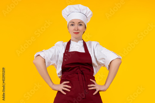 The female chef puts her ha...