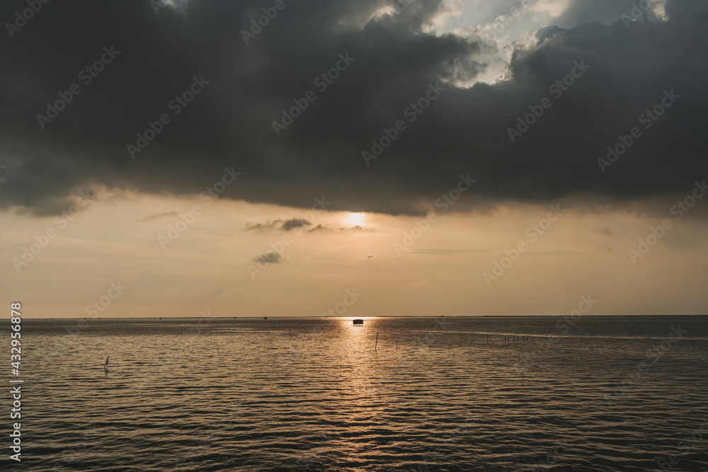 Tiny fishing hut in the middle of sunset and the sea. Tiny fishing hut in the middle of sunset and the sea.