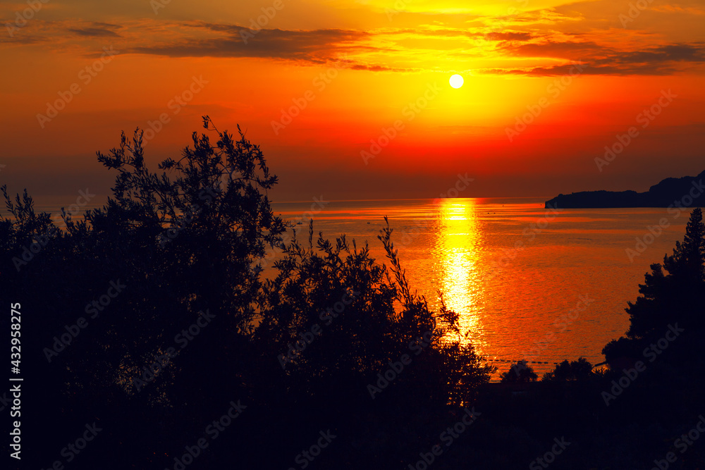 Awesome Sunset over the Adriatic Sea . sundown reflection in the sea water . Beautiful tropical twilight
