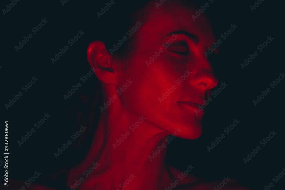 Portrait of a young woman in red light Portrait of a young woman in red light