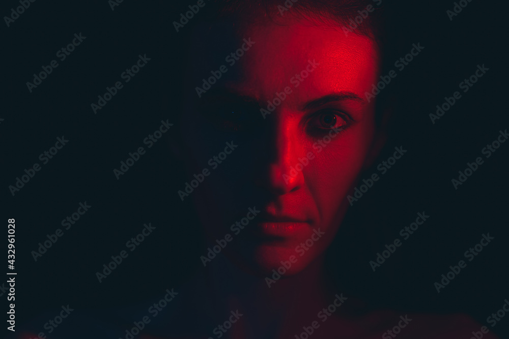 Portrait of a young woman in red light Portrait of a young woman in red light