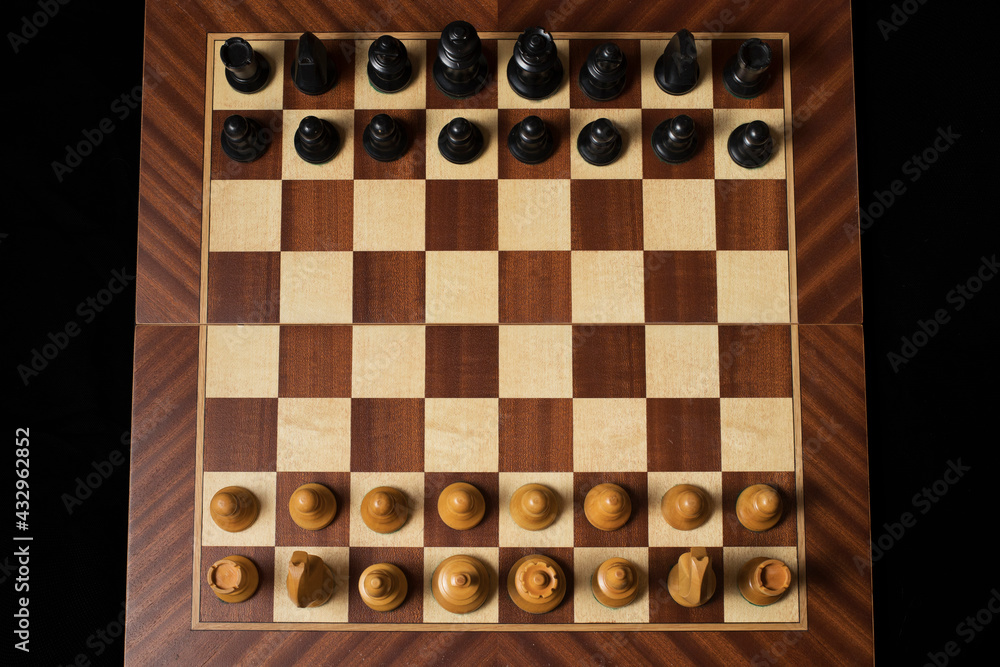 Black Chess piece over chessboard