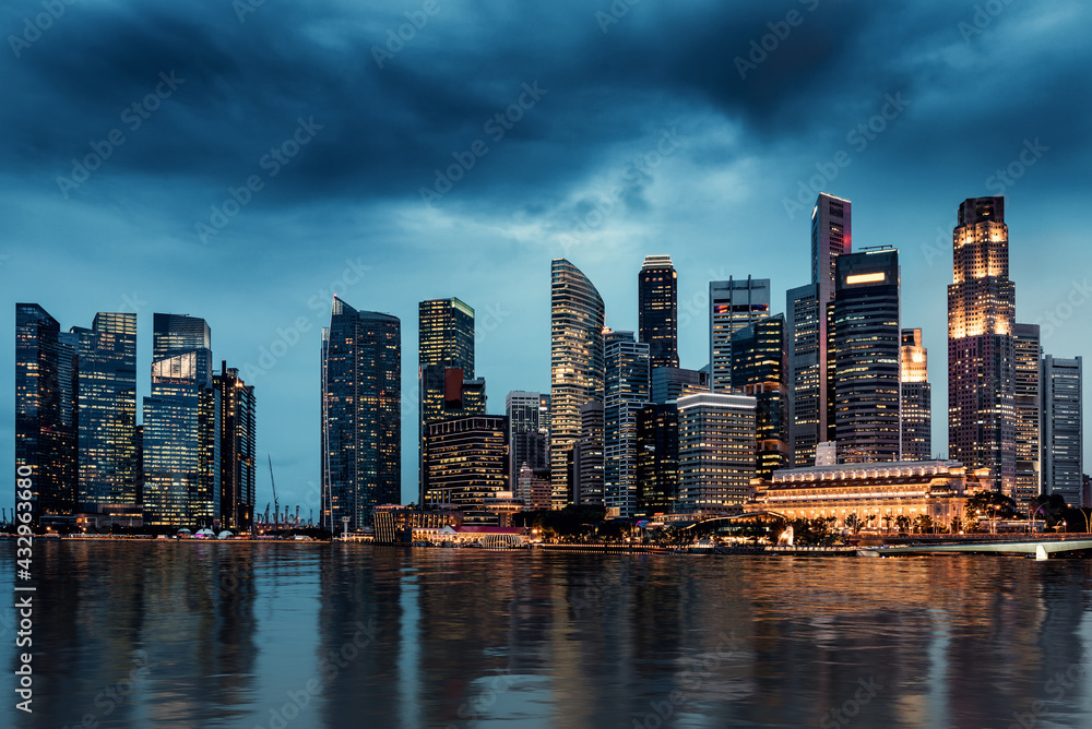 Business Financial Downtown City and Skyscrapers Tower Building at Marina Bay, Singapore, Cityscape Urban Landmark and Business Finance District Center in Twilight Scene, Capital City of Singapore.