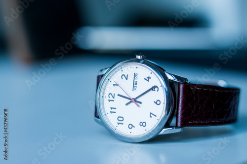 Beautiful Watch with Brown Leather Strap on White Desk