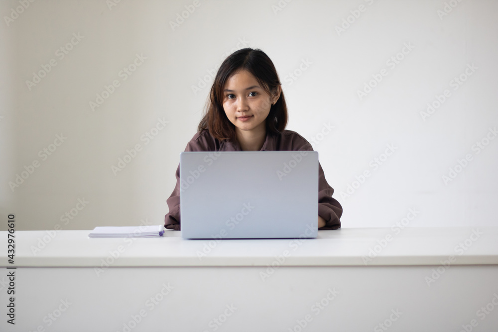 Portrait of beautiful young woman working in the office. Portrait of beautiful young woman working in the office.