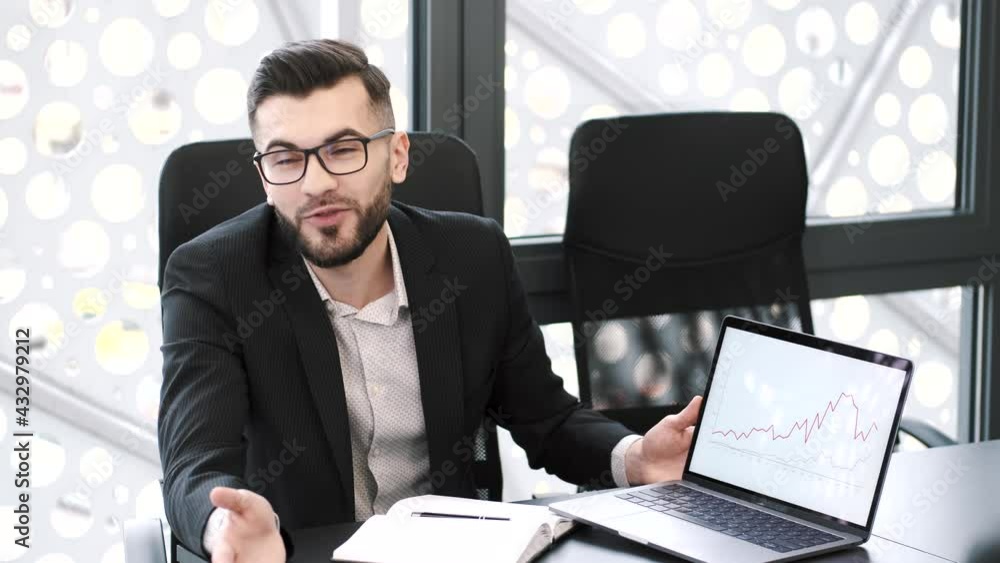 Handsome young man working at office desk with laptop Handsome young man working at office desk with laptop