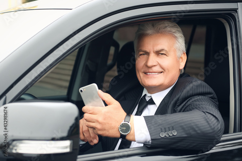 Senior businessman using mo...