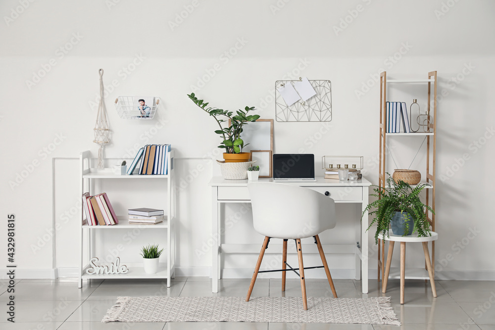 Fototapeta premium Comfortable workplace in interior of light room