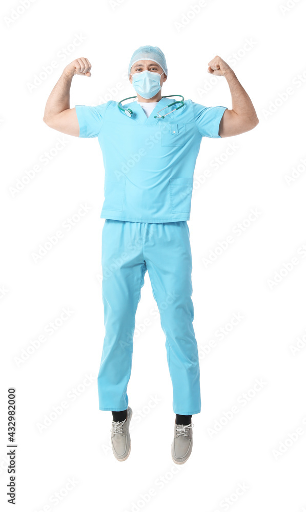 Jumping male doctor on white background