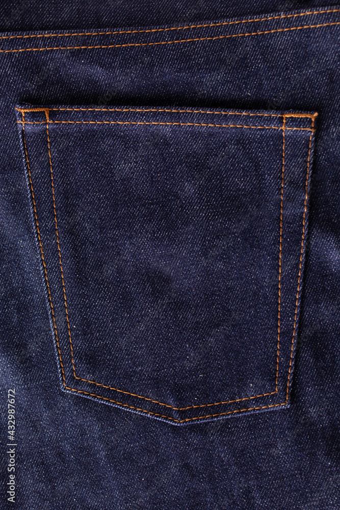 Blue Jeans back pocket close-up. Dry denim jeans. Blue Jeans back pocket close-up. Dry denim jeans.