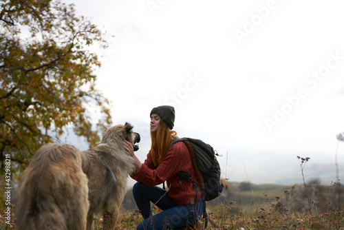 women hikers tivikom nature mountains landscape travel playing dogs