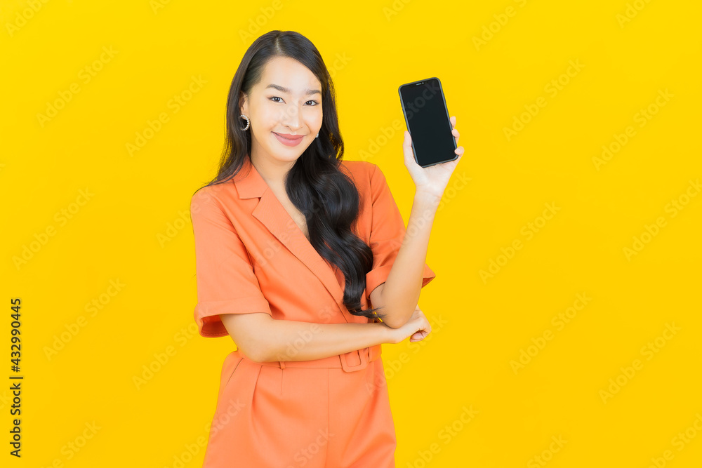 Portrait beautiful young asian woman smile with smart mobile phone Portrait beautiful young asian woman smile with smart mobile phone