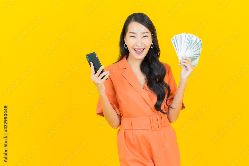 Portrait beautiful young asian woman smile with a lot of cash and money Portrait beautiful young asian woman smile with a lot of cash and money