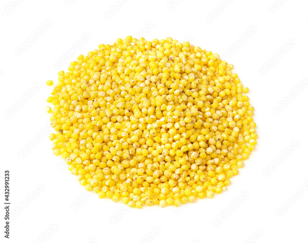 pile of millet groats closeup on white pile of millet groats closeup on white