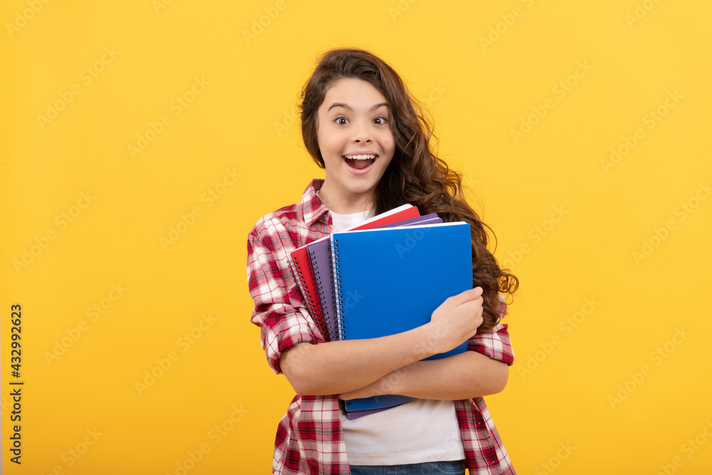 surprised school kid ready to study with workbook, back to school surprised school kid ready to study with workbook, back to school