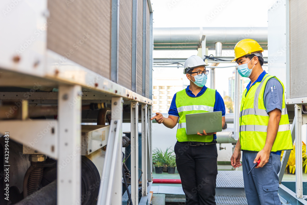 Two Asian Male engineering working at factory. Two Asian Male engineering working at factory.