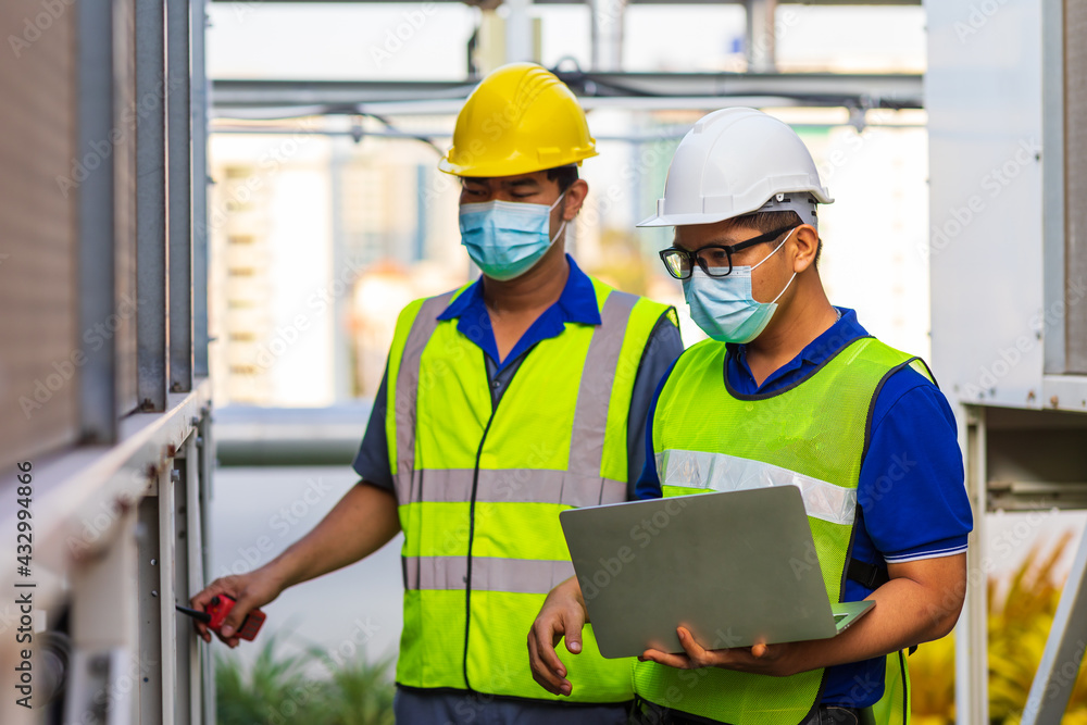 Two Asian Male engineering working at factory. Two Asian Male engineering working at factory.