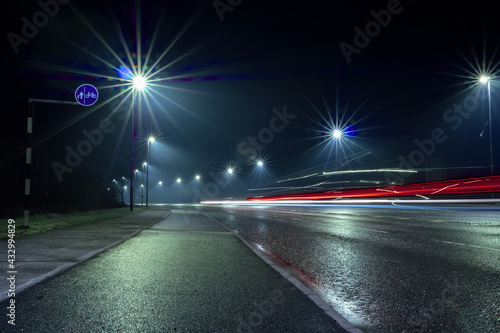 Car light trail and city light. Night shot. Vehicle back lights illumination on highway © mark_gusev