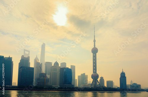 Shanghai skyline in sunny morning with cloud sky, misty and Huangpu river cityscape view