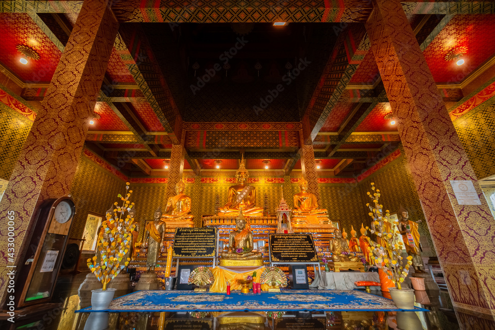 The gold Buddha statue in the temple at Wat Tham Chariya Phirom, Samut Sakhon, Thailand The gold Buddha statue in the temple at Wat Tham Chariya Phirom, Samut Sakhon, Thailand